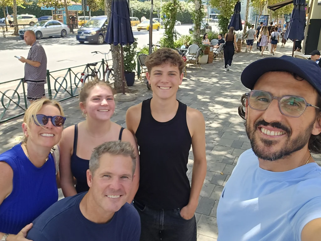 Tirana food tour with local guide and happy travelers exploring local spots
