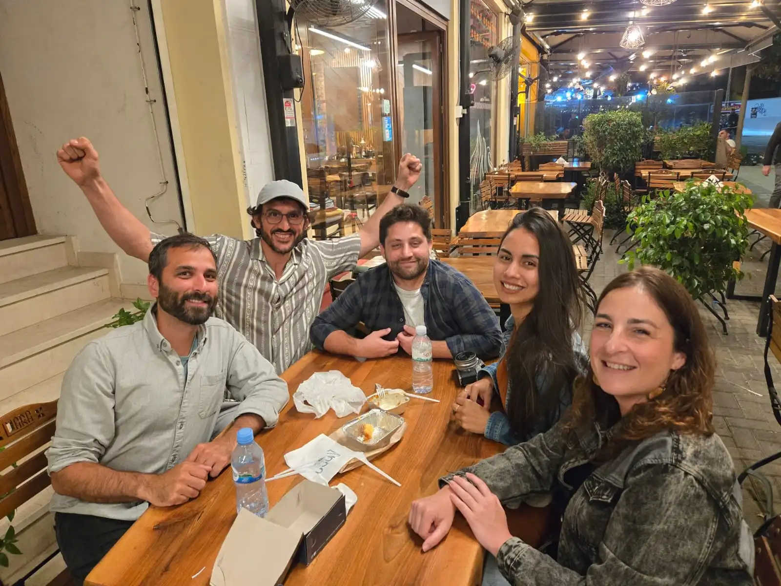 Tirana food tour with local guide and travelers tasting traditional Albanian dishes